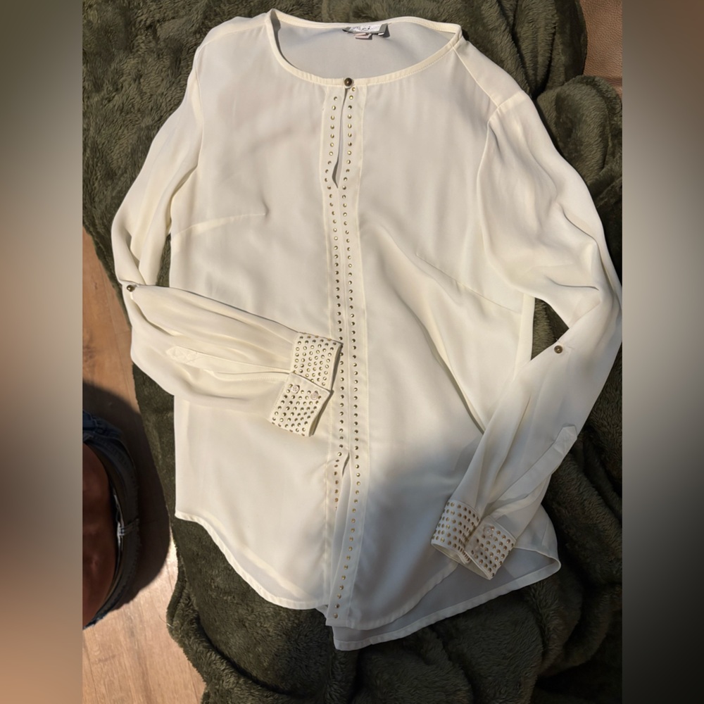 ECI Cream Blouse with flat metal studs down center and the cuff of the sleeves